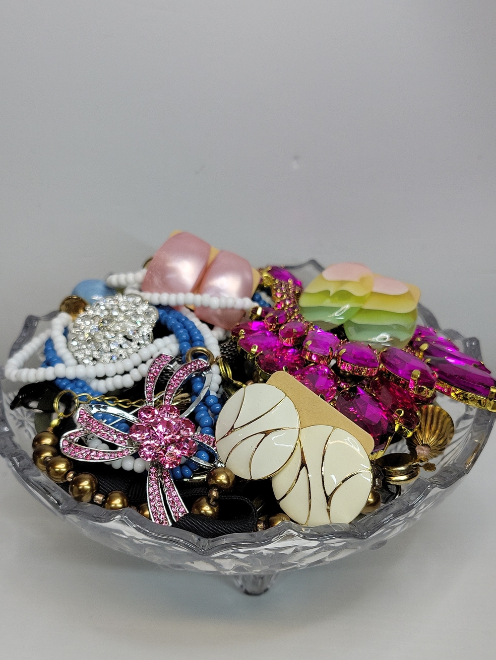 Assorted Jewelry In A Glass Dish